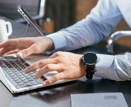 Person using a laptop to review job and skill-training options